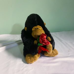 CUTE GORILLA WITH A RED FLOWER